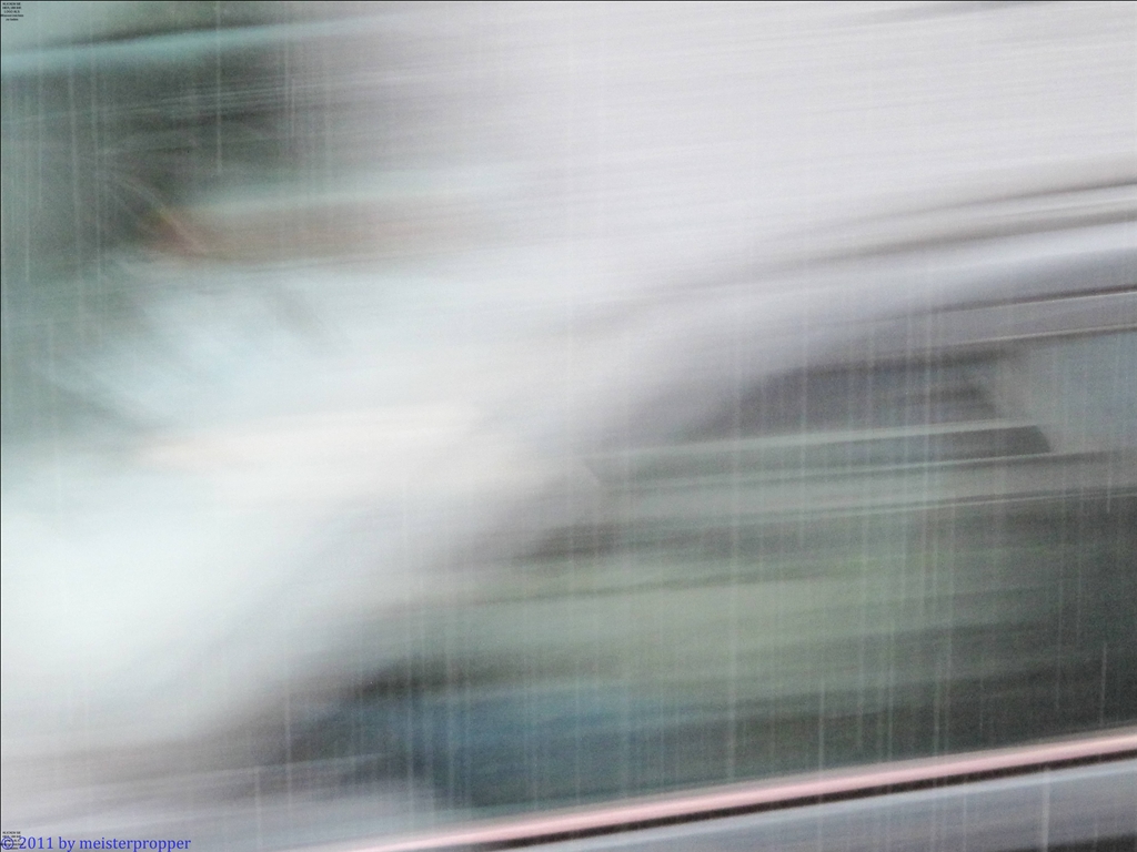 1/20 sec., Auto im Regen am Fenster vorbei