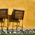 2 chairs in the sun.