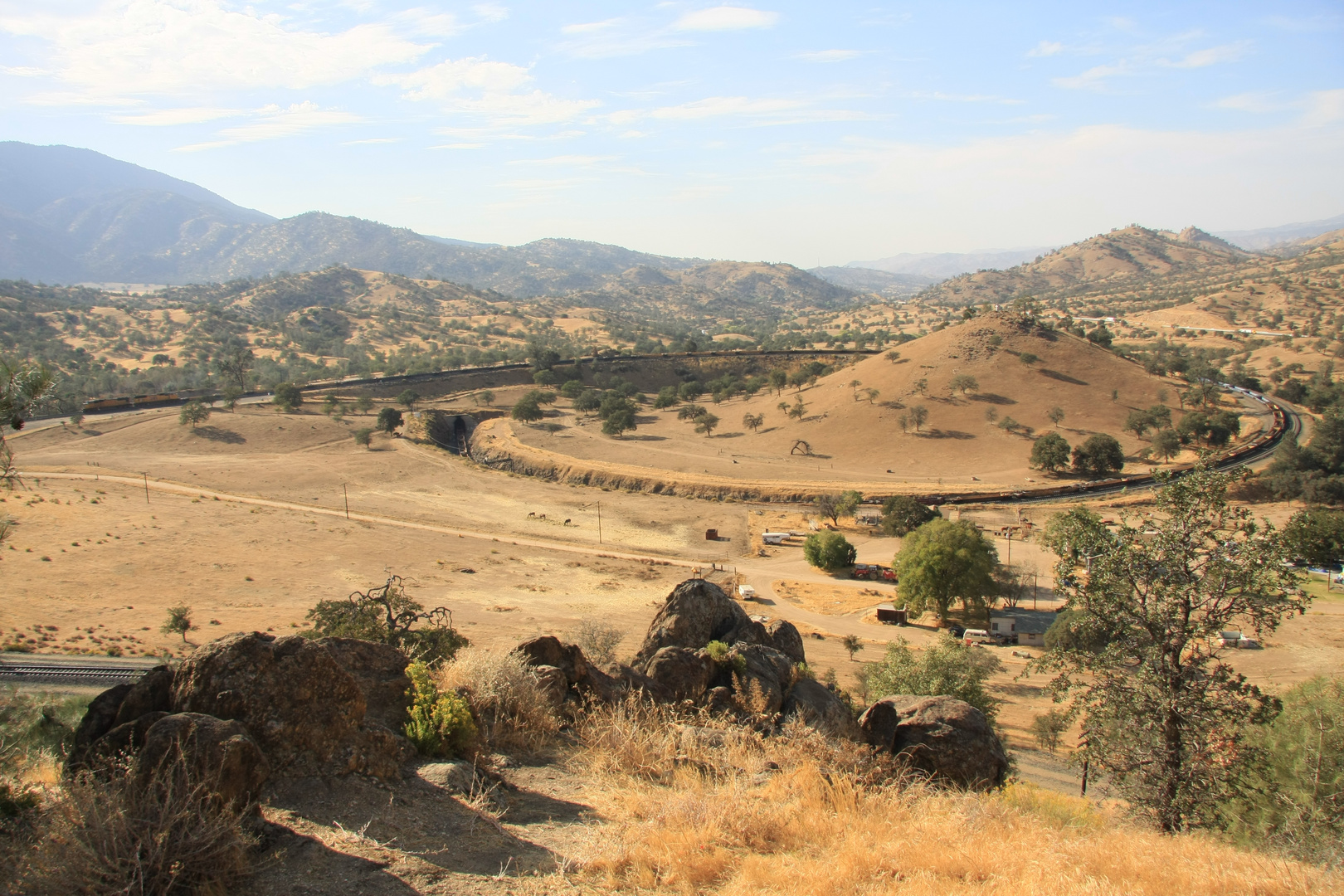 2 UP engines are pulling empty container cars up the Tehachapi Loop to the Mojave Desert