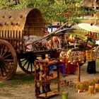 2) Young lady displaying some colourful local craft in Myanmar (Burma) Story within.