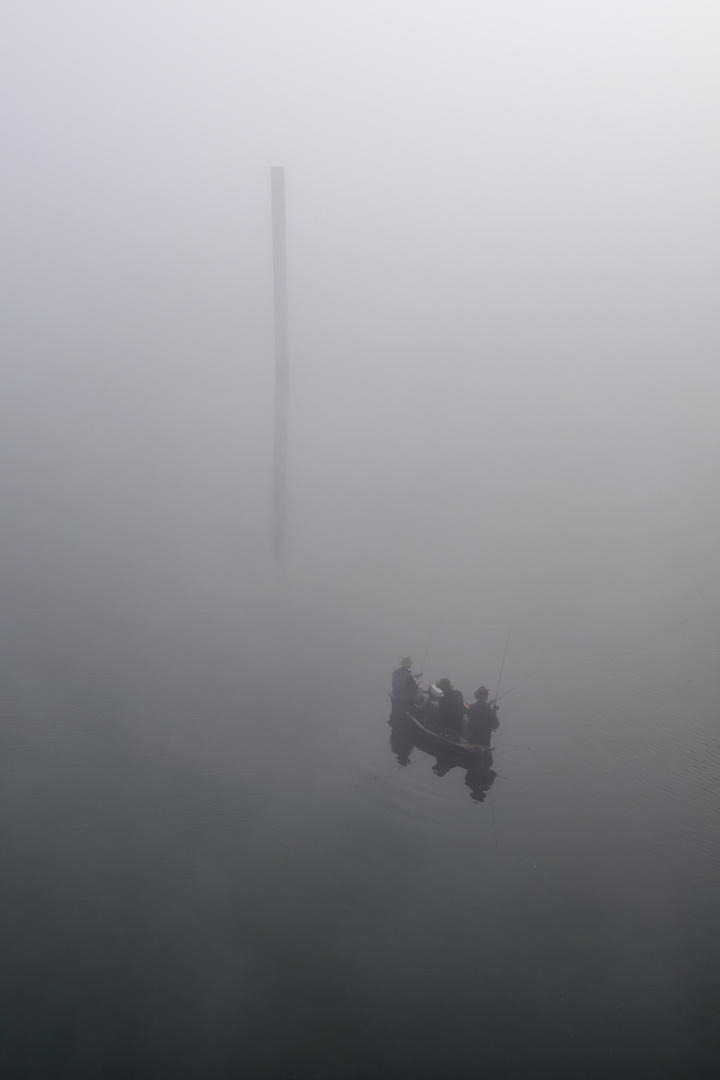 3 men in a boat