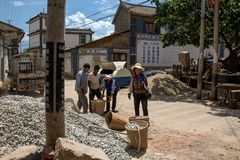 397 - Female Construction Workers Supplying Broke-Stones for the Production of Concrete