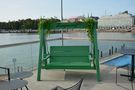 The swing on the roof of restaurant Allas sea pool by Raimo Ketolainen