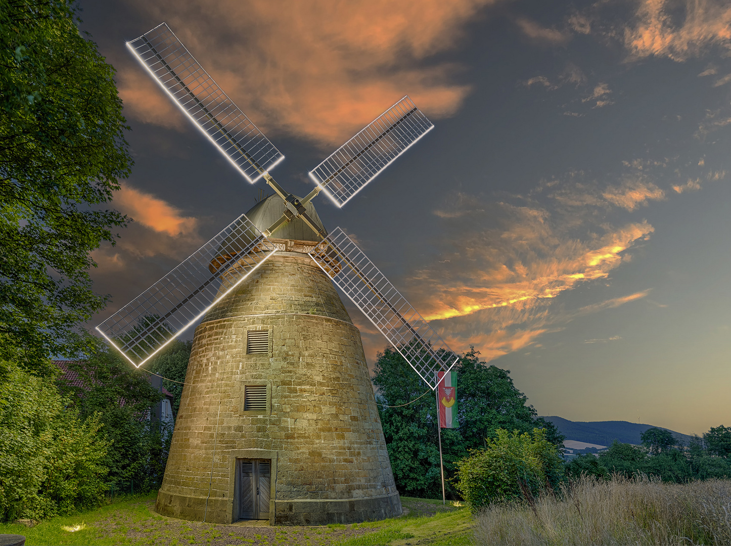 5702Q-09Q Windmühle Rodenberg beleuchtet Abendrot