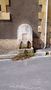 A small water fountain in the streets of Bergerac  by Bobby Friemer