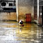 a begger in front of a mosque