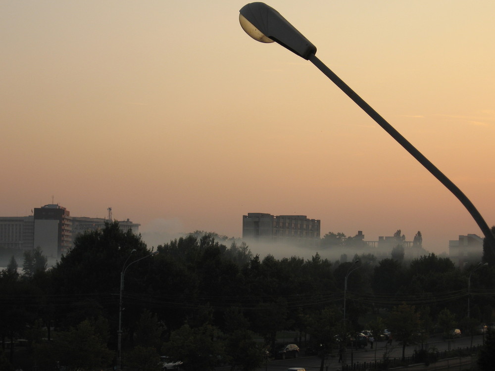 A blanket of fog over the city and a guiding light