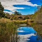 a bridge over calm water