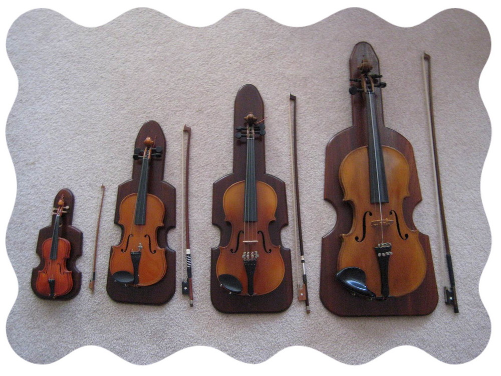 A FAMILY OF 4 VIOLINS