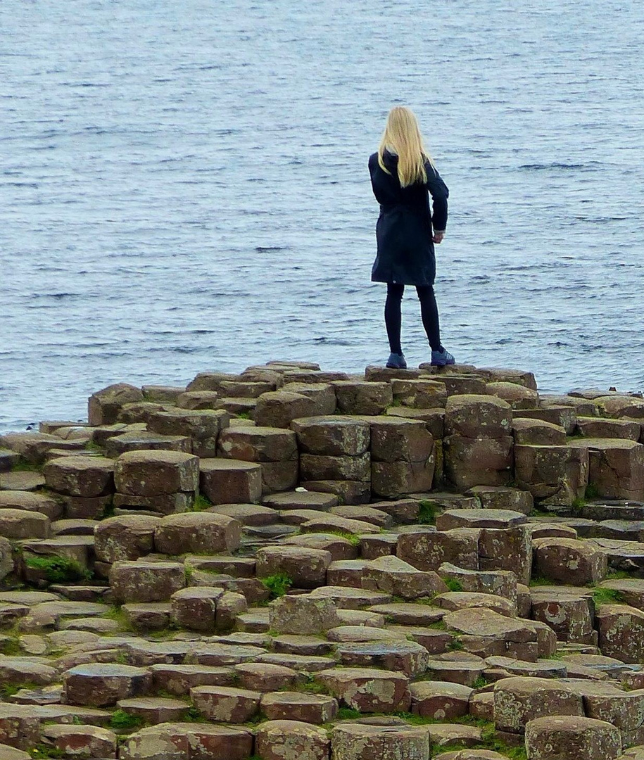 a girl at Giant's Causeway. Northern Ireland