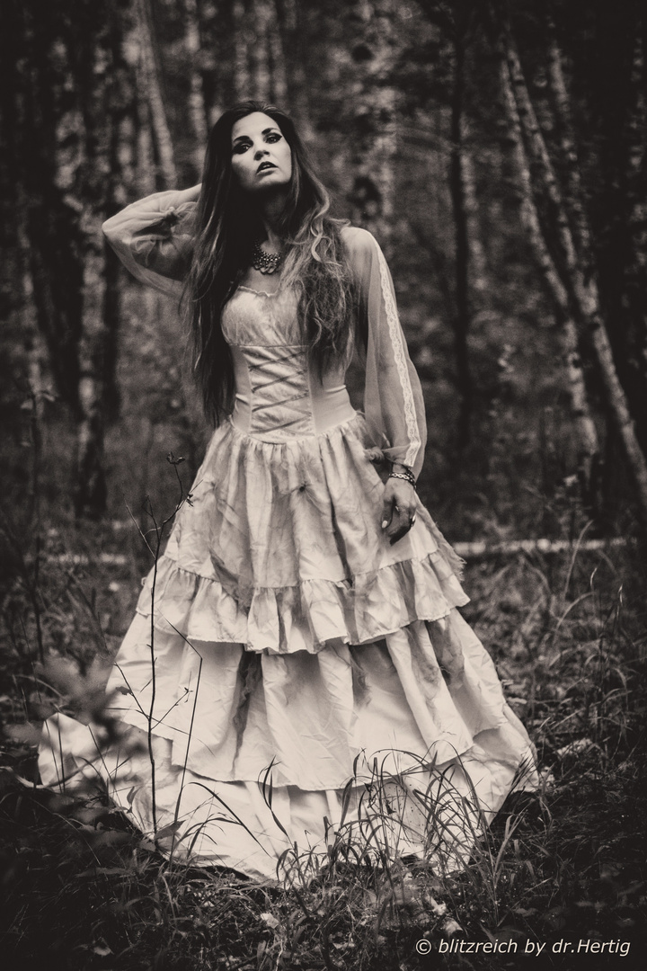 a girl in the forest......