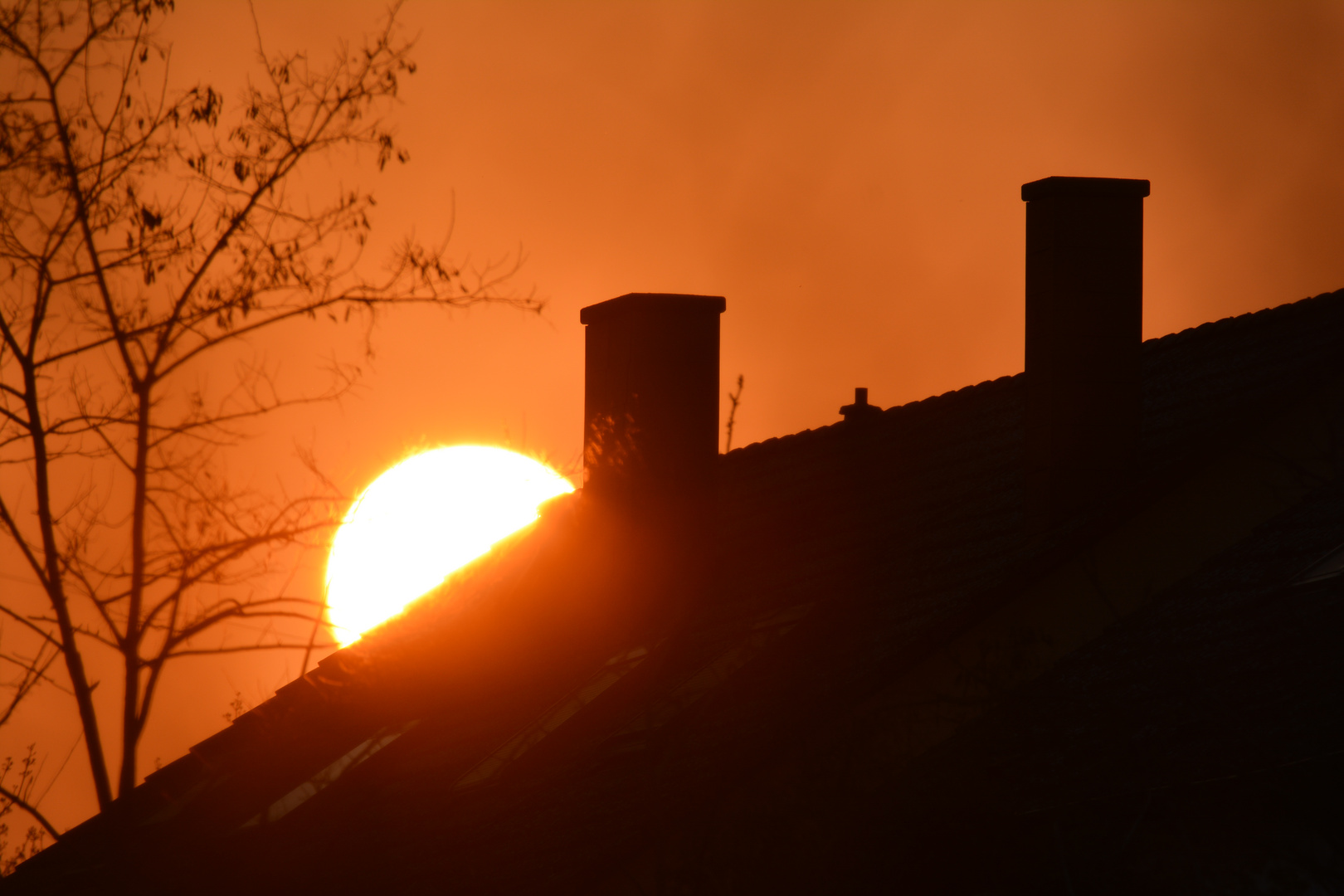 A house roof with sunset