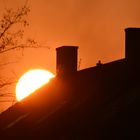 A house roof with sunset