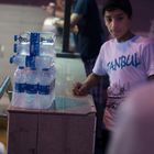a kid selling water on the street - Istanbul