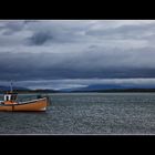 a lonely fishing boat