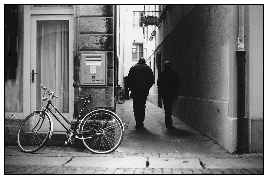 a mailbox, a bike and two strangers