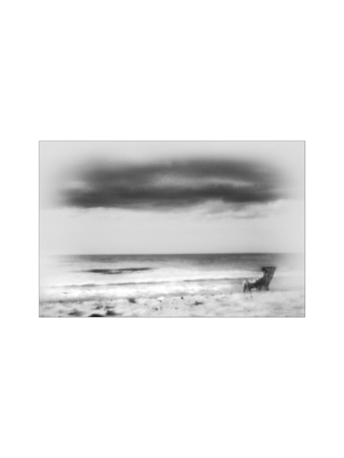 a man reading on the beach