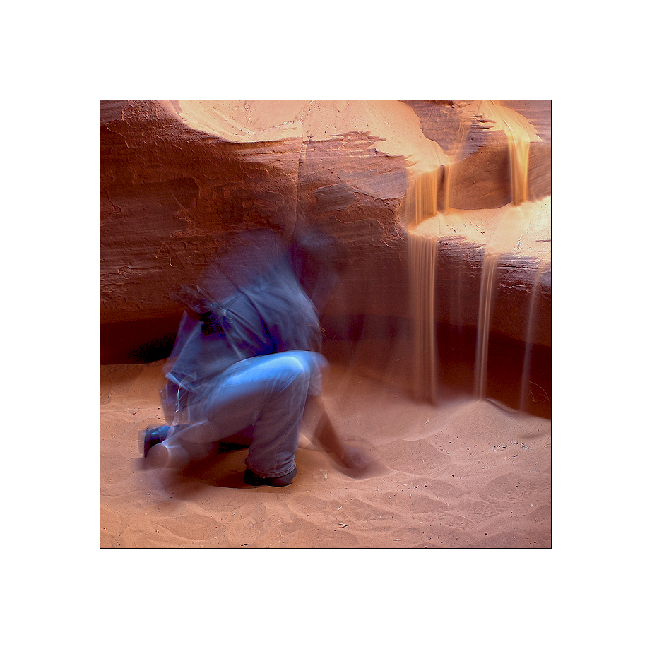 a navajo lets the sand run.