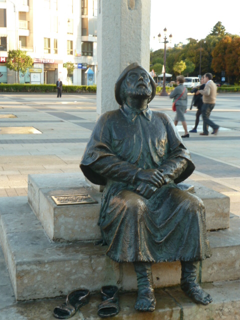 A PILGRIM AT SAN MARCOS LEON ON HIS WAY TO SANTIAGO WITH HIS SORE FEET