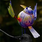 A rainbow coloured iron bird