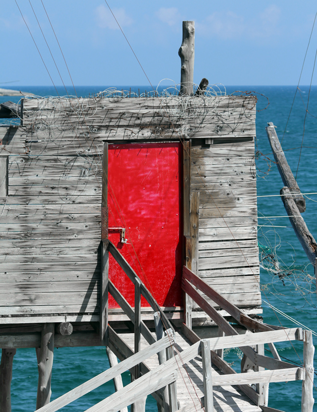 A red door on the sea