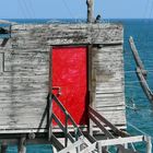 A red door on the sea