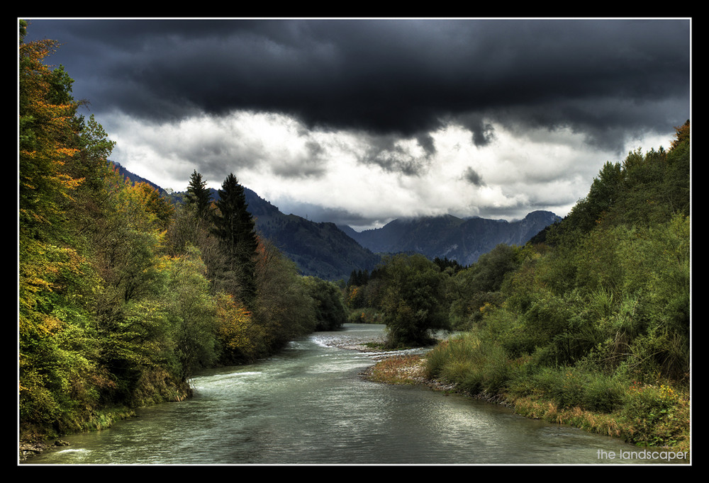 a river under a dark sky