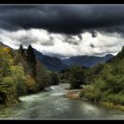 a river under a dark sky