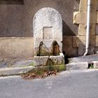 A small water fountain in the streets of Bergerac 