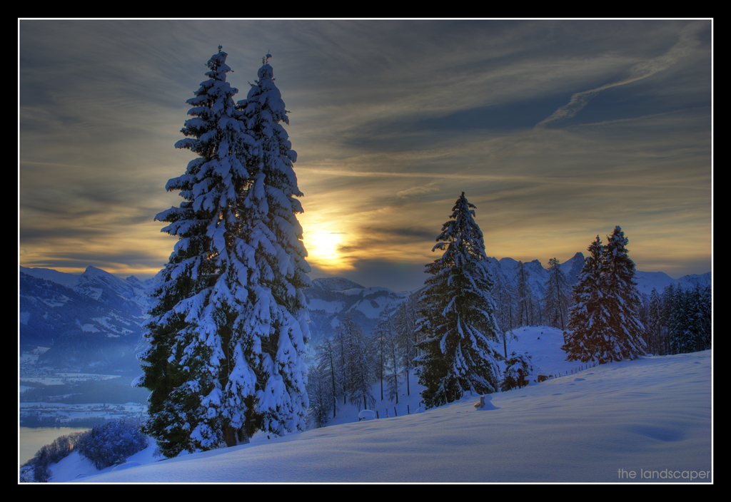 a snowy landscape and the sun