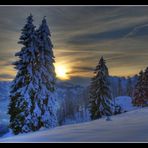 a snowy landscape and the sun