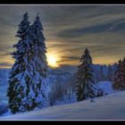 a snowy landscape and the sun