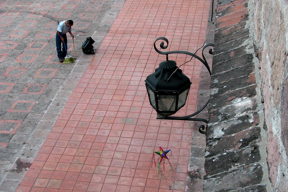 A Street Sweeper, a Lantern and a Pinata