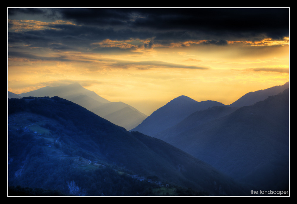 a sunset and the hills