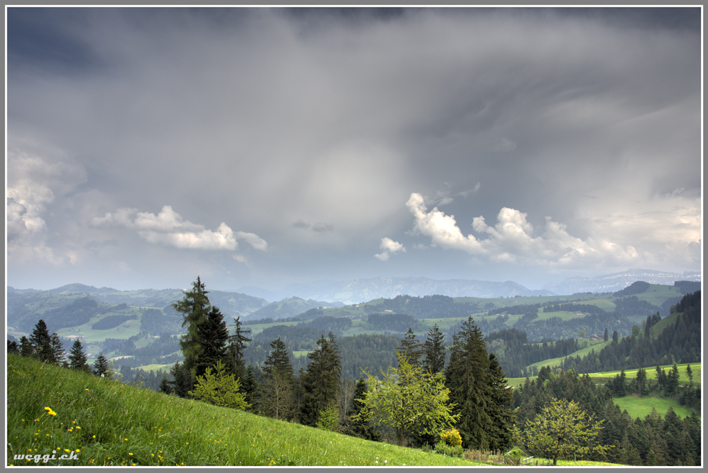 a wide landscape and the upcoming thunderstorm