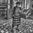 A Woman and Her Wooden Stool.