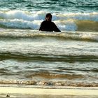 A woman in burqa in the sea, Tel Aviv, Israel