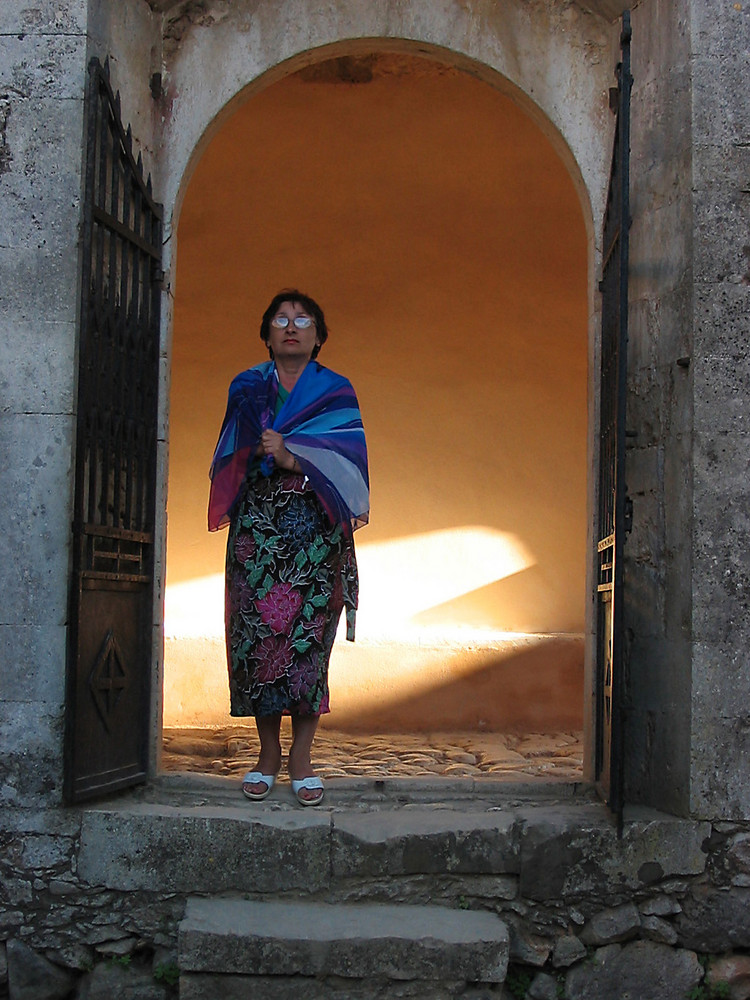 A woman standing in the arch