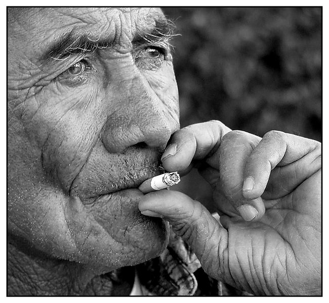 A worker's face - smoking ...