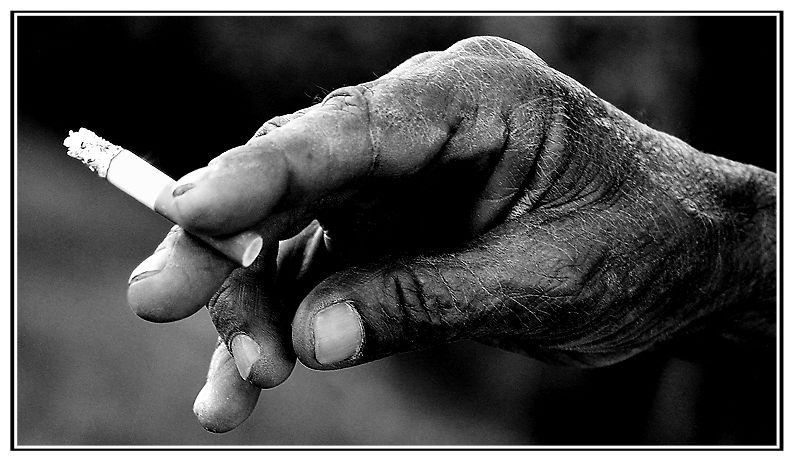 A worker's hand - smoking ...