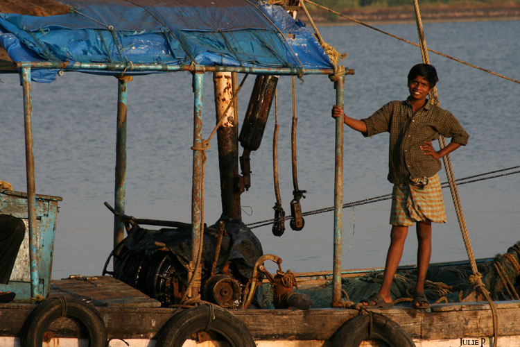 A young boy on a boat ...