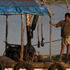 A young boy on a boat ...