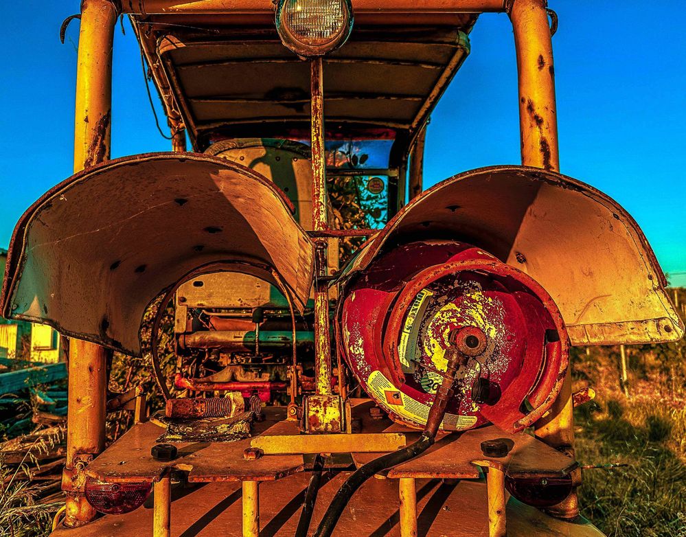 abandoned, rusting, cannibalized forklift