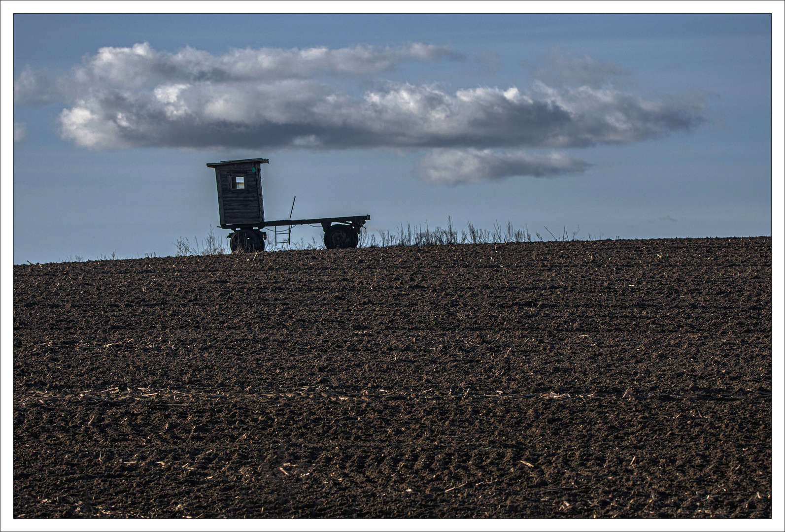 Ackerlandschaft mit Wolke