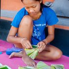 Adii making Canang Sari