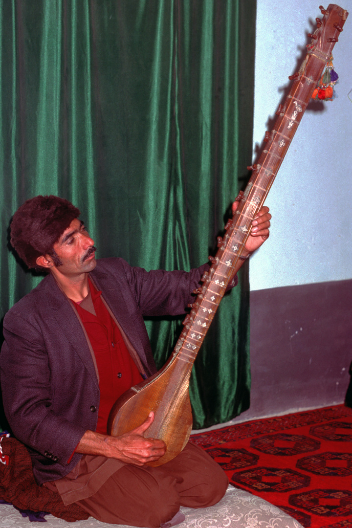 Afghanian musician plays his instrument