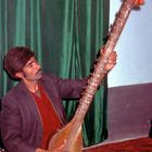 Afghanian musician plays his instrument