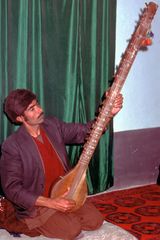 Afghanian musician plays his instrument