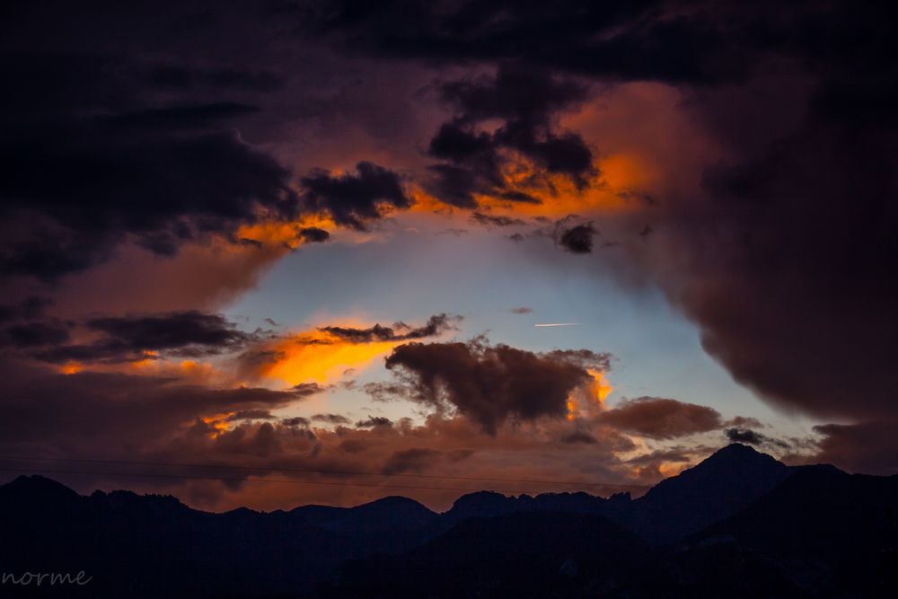 Aircraft crosses hole in the clouds