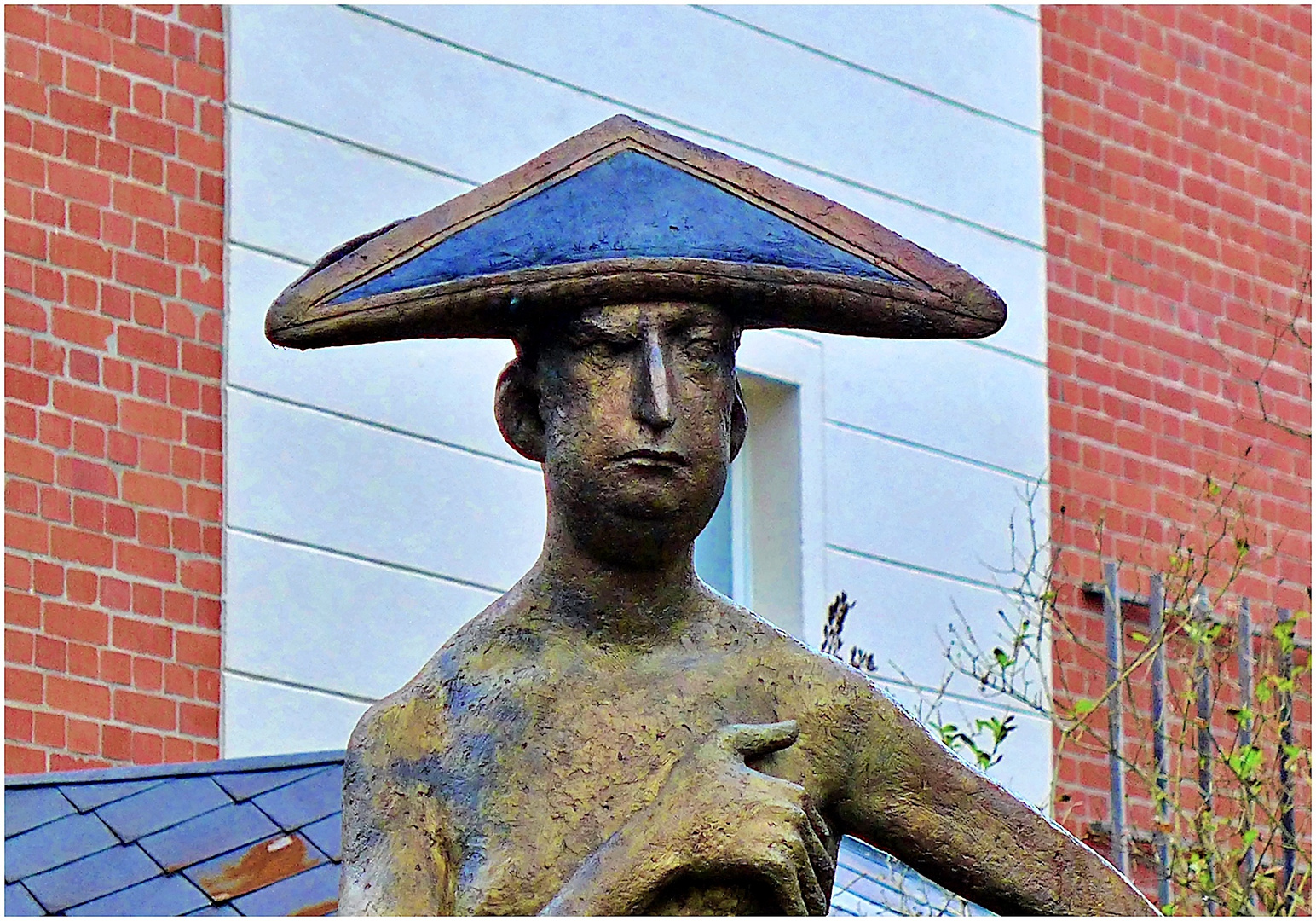 Akrobat mit blauem Hut